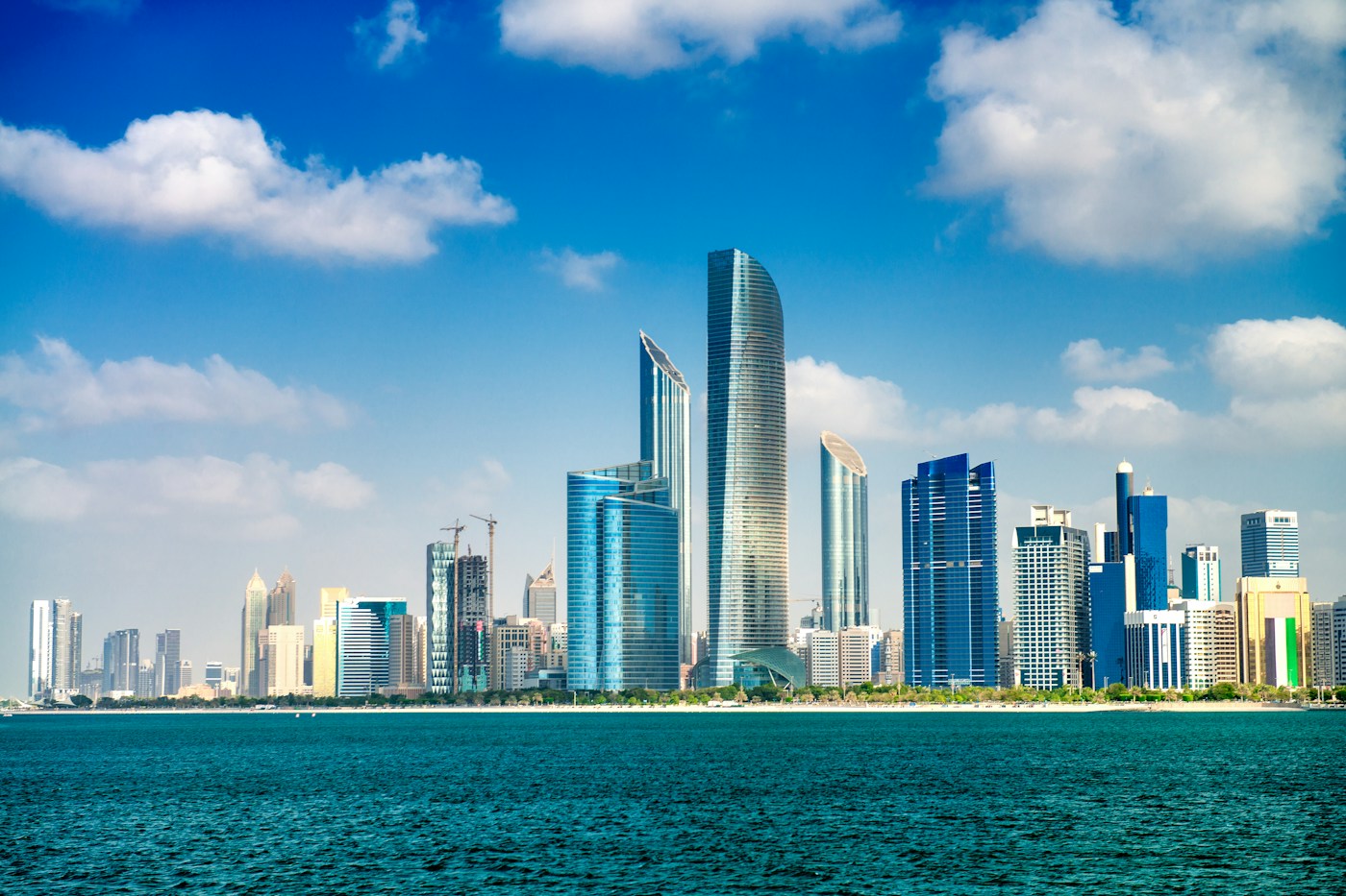 Abu Dhabi’s modern towers beside the turquoise waterfront